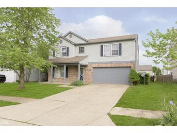 Two-story home with light gray siding, brick accents, and a two-car garage at 2348 Shadowbrook Dr, Plainfield, IN 46168
