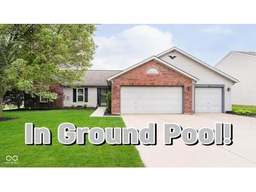 Charming single Gathering home with a well-manicured lawn and in-ground pool text overlay at 324 Palmyra Dr, Indianapolis, IN 46239