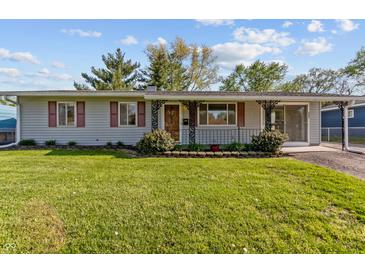 Charming single-story home featuring a well-maintained lawn and inviting front porch at 3561 Winings Ave, Indianapolis, IN 46221