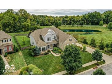 Beautiful two-story home with manicured lawn and landscaping, set on a corner lot with mature trees at 4707 Branch View Way, Indianapolis, IN 46234