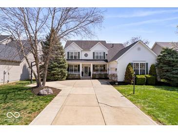Charming two-story home with a spacious driveway and well-manicured lawn and front porch at 16726 Blackbird Ct, Noblesville, IN 46060