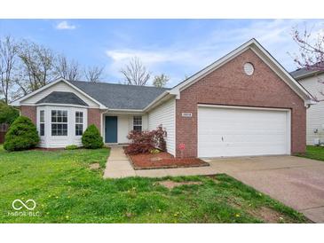 Charming single-story home with brick and vinyl siding and an attached two-car garage at 19516 Golden Meadow Way, Noblesville, IN 46060