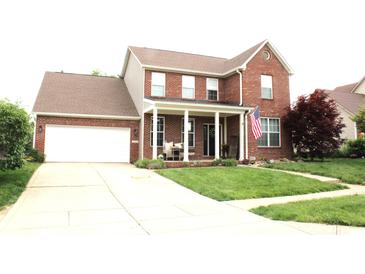 Charming two-story brick home with a well-manicured lawn and attached two car garage at 2120 Dakota Dr, Franklin, IN 46131