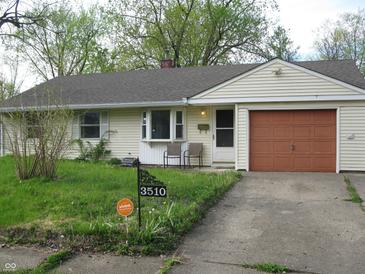 Charming ranch-style home featuring a well-maintained lawn and a cozy front porch area at 3510 Maura Ct, Indianapolis, IN 46235