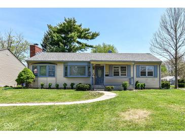 Charming single-story home features a well-manicured lawn and inviting walkway at 251 S 12Th Ave, Beech Grove, IN 46107