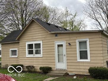 This charming home features a durable roof, neutral siding, and an inviting front door for easy access at 598 Young St, Franklin, IN 46131