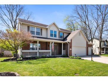 Charming two-story home with brick facade, well-manicured lawn, and attached two car garage at 6373 Thornridge Dr, Avon, IN 46123