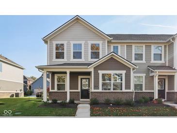 Charming two-story home with mixed siding, a covered porch, and a well-manicured front lawn at 7277 Governors Row, Avon, IN 46123