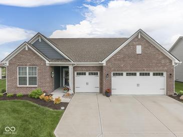 Charming brick home with a well-manicured lawn and a two-car garage, perfect for suburban living at 3697 Chalmers Dr, Bargersville, IN 46106
