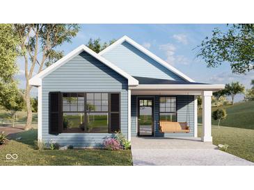 Charming single-Gathering home with horizontal siding, black shutters, front porch, and an inviting swing at 953 Udell St, Indianapolis, IN 46208