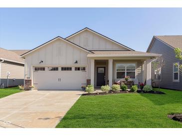 Charming single-story home featuring a two-car garage, inviting front porch, and manicured lawn at 796 Sapp Cir, Westfield, IN 46074