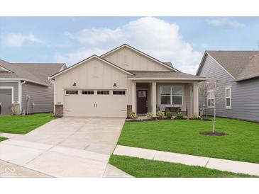 Charming single-story home featuring a well-manicured lawn, a covered porch, and an attached two-car garage at 796 Sapp Cir, Westfield, IN 46074