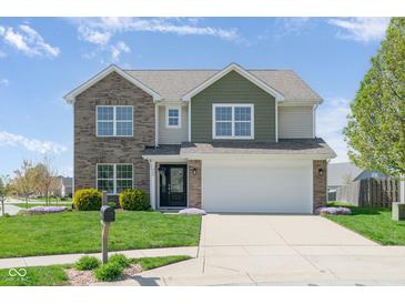 Charming two-story home with manicured lawn, brick and siding accents, and attached two-car garage at 996 Denton Ct, Westfield, IN 46074