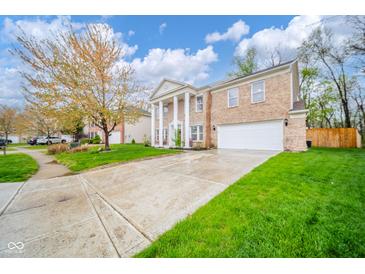 Stately two-story brick home with a grand entrance and a well-kept front yard at 10090 Eagle Eye Way, Indianapolis, IN 46234