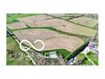 Expansive aerial view of the acreage of land with mature trees surrounding it at 1630 N 400 W, Bargersville, IN 46106