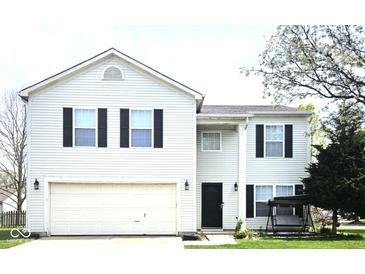 Traditional two-story home featuring white siding, black shutters, and an attached two-car garage at 6634 Frankenberger Dr, Indianapolis, IN 46237