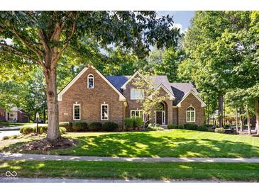 Charming brick home with a manicured lawn and mature trees in a desirable neighborhood at 7126 Nile Ridge Ct, Indianapolis, IN 46236