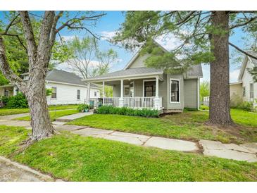 Charming home with a covered front porch and well-maintained lawn, perfect for relaxing outdoors at 1114 Pennsylvania St, Columbus, IN 47201