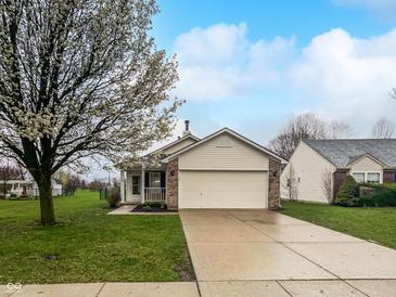 Charming single-story home with a two-car garage and a well-maintained front yard with a beautiful tree at 8146 Whitaker Valley Blvd, Indianapolis, IN 46237