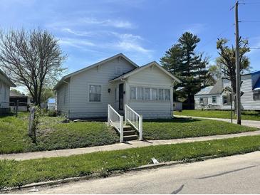 Charming single-Gathering home with a well-maintained lawn and cozy curb appeal at 1203 E 27Th St, Anderson, IN 46016