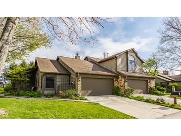 Charming townhouse with a well-manicured lawn and a two-car garage, perfect for comfortable living at 2236 Calaveras Way, Indianapolis, IN 46240