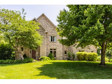 Charming brick home with a well-maintained lawn and mature trees offering curb appeal at 269 Manchester Ct, Noblesville, IN 46060