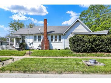 Charming single Gathering home showcasing a tidy lawn and classic brick chimney at 704 Baronne St, Lebanon, IN 46052