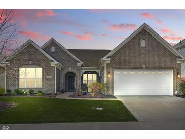 Charming brick home with a well-manicured lawn and inviting front entrance at 1275 Cliff View Dr, Westfield, IN 46074