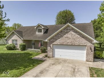 Charming single-story home with brick accents, a two-car garage, and well-maintained landscaping at 1858 Jenny Dr, Martinsville, IN 46151