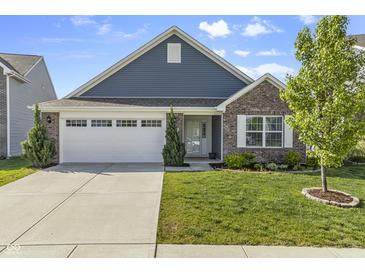 Charming single-Gathering home with a manicured lawn, a two-car garage, and a welcoming front porch at 5465 Tanglewood Ln, Whitestown, IN 46075