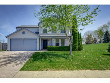 Charming two-story home featuring a well-maintained lawn and a classic blue siding at 6209 Amber Valley Ln, Indianapolis, IN 46237