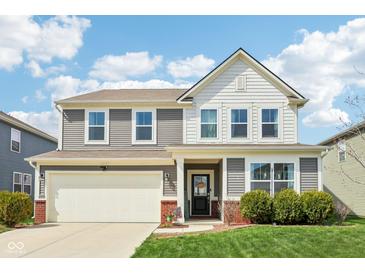 Charming two-story home with a front yard, attached garage, and inviting curb appeal at 10358 Pronghorn Ln, Indianapolis, IN 46239