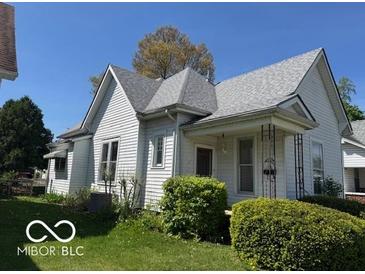 Charming two-story home features a well-maintained yard and classic architectural details at 113 1St St, Shelbyville, IN 46176