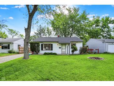 Charming single-story home with a well-manicured lawn, fresh landscaping, and bright, natural light at 2307 Magnolia Pl, Indianapolis, IN 46219