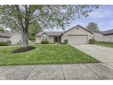 Charming single-Gathering home with a well-manicured lawn and a two-car garage at 17752 Sanibel Cir, Westfield, IN 46062