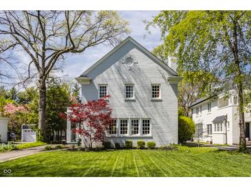 Charming home showcasing a manicured lawn and delightful curb appeal at 4134 N Pennsylvania St, Indianapolis, IN 46205