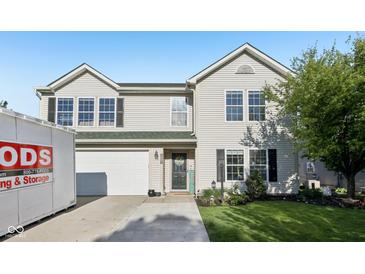 Charming two-story home with a well-manicured lawn, attached garage, and a welcoming front entrance at 2116 Crimson Ln, Lebanon, IN 46052