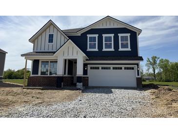 Charming two-story home featuring navy siding, white trim, and a spacious two-car garage at 3932 Andean Ct, Bargersville, IN 46106
