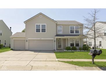Charming two-story home featuring a two-car garage and well-maintained front lawn at 5646 Skipping Stone Dr, Indianapolis, IN 46237