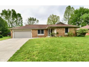 Charming brick ranch home with attached garage and a well-maintained lawn at 135 Hickory Ct, Greenwood, IN 46142