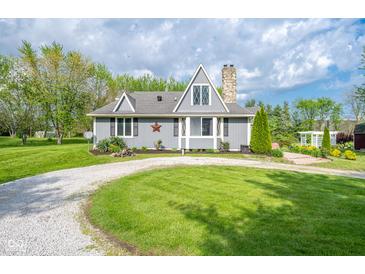 Charming home with updated exterior, stone chimney, and well-maintained yard with mature trees at 171 Williams Trce, Plainfield, IN 46168