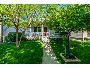 Charming home with a well-maintained front yard, sidewalk, and welcoming porch at 2306 Alabama St, Indianapolis, IN 46205