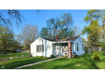 Charming single-story home with a well-maintained lawn and mature trees, offering a cozy curb appeal at 2315 E 3Rd St, Anderson, IN 46012