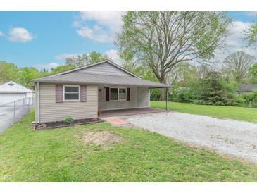 Charming one-story home featuring a cozy front porch, stone accents, and a well-maintained lawn at 2539 S Lyons Ave, Indianapolis, IN 46241