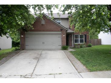 Charming two-story brick home with a well-maintained lawn and attached two-car garage at 8912 Hosta Way, Indianapolis, IN 46113