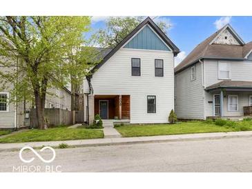 Charming two-story home with modern siding, complemented by a well-maintained lawn at 1808 E 11Th St, Indianapolis, IN 46201