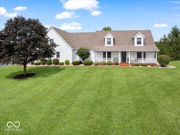 Charming two-story home with a large front yard and inviting porch at 6086 W 850 S, Edinburgh, IN 46124