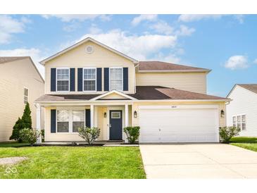 Charming two-story home with a well-manicured lawn, a two-car garage, and classic blue shutters at 6837 W Burlington Dr, McCordsville, IN 46055