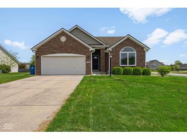 Charming brick ranch home with a well-manicured lawn and attached two car garage at 1105 Wild Ridge Blvd, Brownsburg, IN 46112