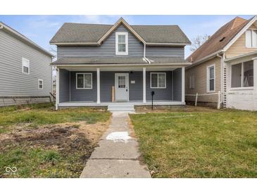 Charming two-story home with a welcoming front porch and gray siding at 3331 Graceland Ave, Indianapolis, IN 46208